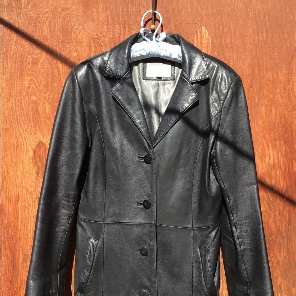 Gorgeous gently used black leather overcoat. Lined